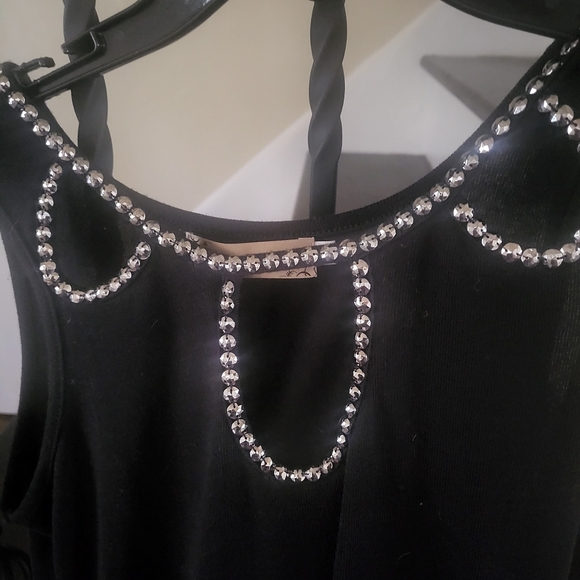 Black form fitting dress with beads on top and openings. Size small. - Picture 5 of 6